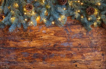 Christmas garland on a rustic wooden backdrop - 661176659