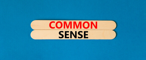Common sense symbol. Concept words Common sense on wooden stick. Beautiful blue table blue...
