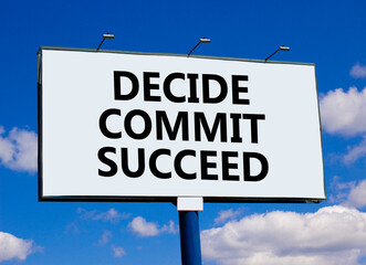 Decide commit succeed symbol. Concept word Decide Commit Succeed on beautiful big white billboard. Beautiful blue sky background. Business decide commit succeed concept. Copy space.