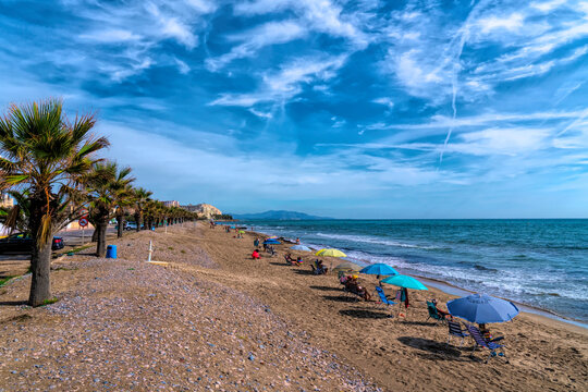 Oropesa del Mar beach of Playa Morro de Gos with palm trees Spain
