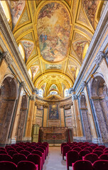 NAPLES, ITALY - APRIL 20, 2023: The nave of baroque church Chiesa di Santa Caterina da Siena.
