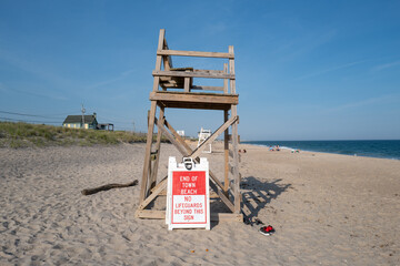 Lifeguard chair on beach with private property notice