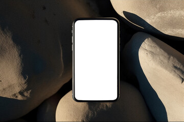 Flatlay phone on sand-colored stones. Free space for text, mockup. Aesthetic elegant picture for social networks