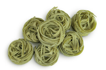Raw tagliatelle green pasta with spinach isolated on white background. Top view. Flat lay