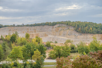 Fototapeta na wymiar Extensive opencast mines near Beroun With mountains of sand in autumn weather