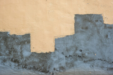 Old wall with a fresh layer of cement plaster