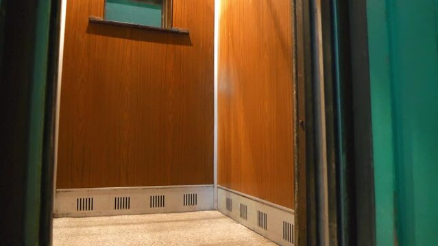 Breakdown to passenger elevator in residential building. Elevator doors jammed. Elevator does not work, doors will not close, video with sound