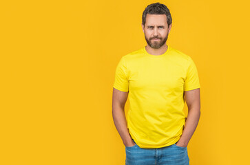 casual man wear yellow tshirt in studio with copy space banner. photo of man wear yellow tshirt.