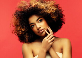 Obraz premium Young beautiful african american woman with afro hair.