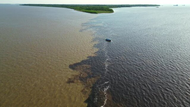 Scenic view of two rivers Negro and Amazon meeting in Manaus Brazil from above