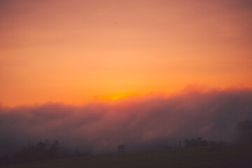 Sunrise covered by clouds in the countryside of southern of Brazil. 