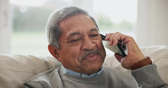 Senior man, smile and phone call in home with social network, mobile contact or communication on sofa in living room. Happy retirement, relax and talking on smartphone for chat, conversation or hello