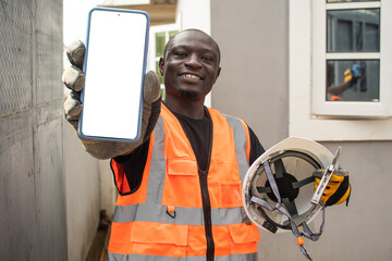 an african engineer showing his phone screen