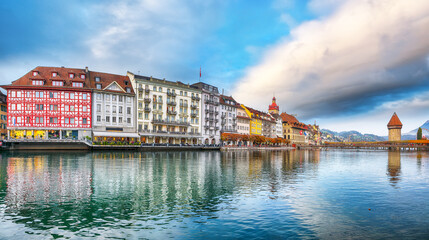 Breathtaking historic city center of Lucerne with famous buildings and old wooden Chapel Bridge (Kapellbrucke).