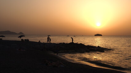 Fototapeta premium View of a beach in Brolo Sicily Italy at sunset. 