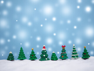 Christmas tree with shiny light for Christmas and New Year holidays background, Winter season, falling snow, Copy space for Christmas and New Year holidays greeting card.