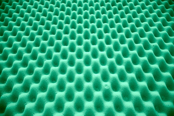 Green foam sponge rubber, mattress support pattern textures background.