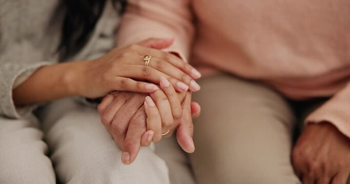 Hand holding, senior and women with empathy or support for retirement, compassion or trust on sofa of home. Elderly, people and counseling for care, kindness and sympathy or comfort on couch