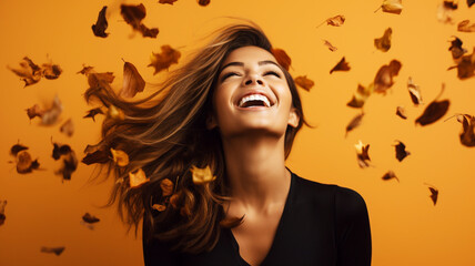Fototapeta na wymiar Beautiful young hispanic woman with autumn leaves