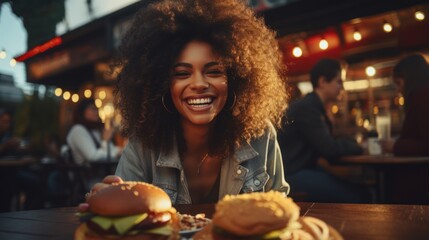 A happy woman eating a burger in an outdoor restaurant as a Breakfast meal craving deal. - obrazy, fototapety, plakaty