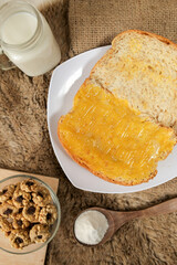Bread with pineapple jam on a plate for breakfast