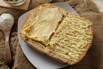 Bread with scrambled egg sandwich on a plate for breakfast and coffee break