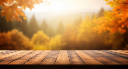 Naklejka na ściany i meble Wooden table and blurred autumn forest background. Can be used for display or montage your products. High quality photo