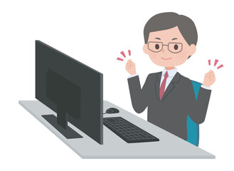 パソコンの前でガッツポーズをするスーツの男性