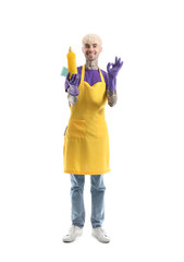 Young tattooed man with bottle of detergent and sponge showing OK on white background