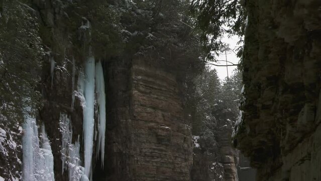 Scenic view from inside Ausable Chasm gorge with frozen waterfall, Adirondacks
