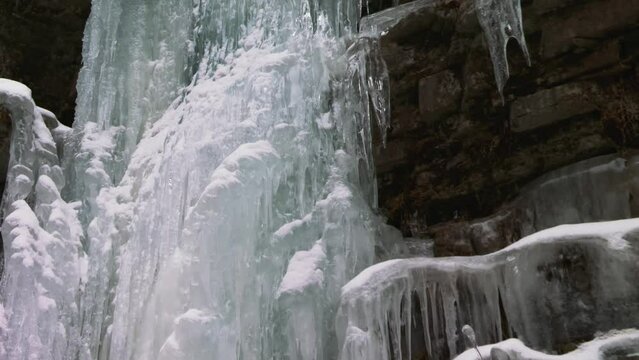 Ice formations from frozen waterfall, Ausable Chasm, Adirondacks, tilting view