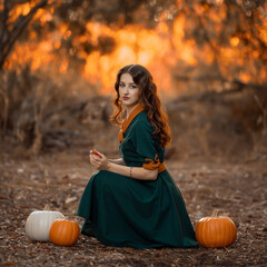 beautiful girl in the woods in green dress red hair with pumpkings, halloween, autumn