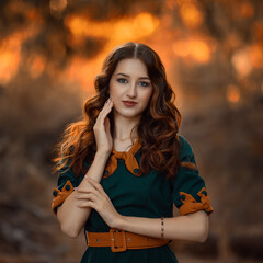 beautiful girl in the woods in green dress red hair with pumpkings, halloween, autumn