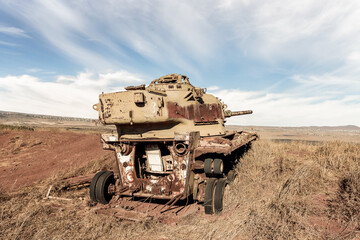 Obraz premium The remains of the Israeli tank destroyed during the Yom Kippur War in Valley of Tears near OZ 77 Tank Brigade Memorial on the Golan Heights in northern Israel