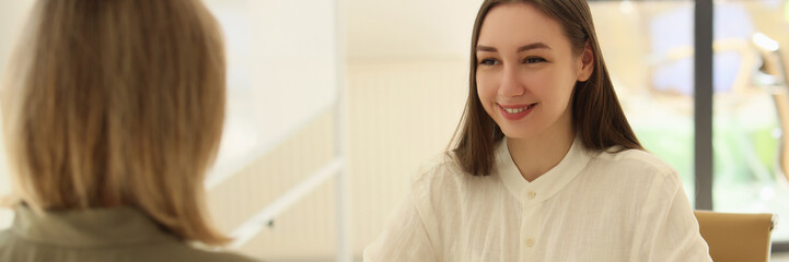 Positive manager conducts job interview with woman in office
