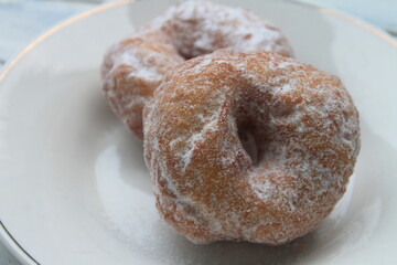 Donuts in a plate on a table 