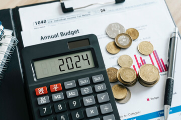 Word 2024 on the calculator and with coins and form for planning annual budget and business tax...