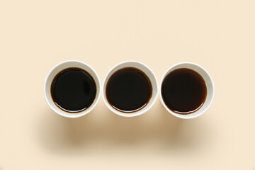 Takeaway paper cups of tasty coffee on light background