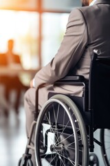 Obraz premium A man working in wheelchair in a modern office