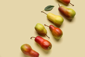 Ripe pears on yellow background