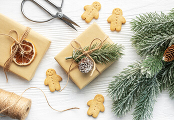 Fototapeta na wymiar Christmas gifts, gingerbread cookies, decorations with christmas tree.