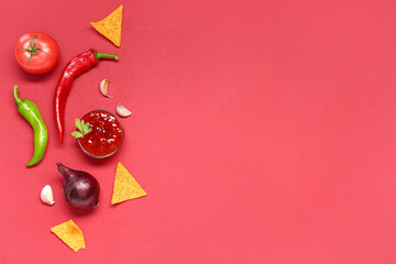 Bowl with tasty salsa sauce, ingredients and nachos on red background