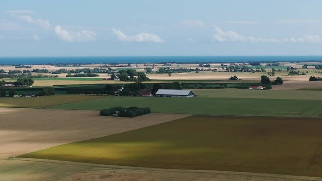Panoramic View Of Rural Fields With Crops In Daytime In Simrishamn Municipality, Sweden. - aerial