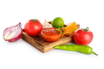 Wooden board with tasty salsa sauce, ingredients and nachos on white background