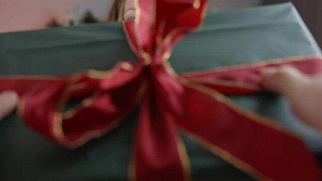 Brunette woman gifting for Christmas with love pov shot 