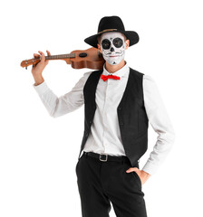 Young man with painted skull and guitar on white background. Mexico's Day of the Dead (El Dia de Muertos) celebration