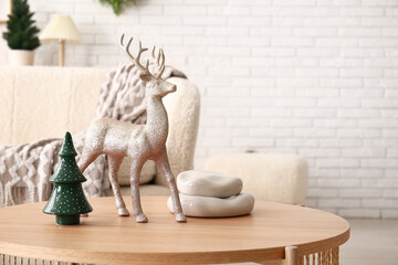 Wooden coffee table with Christmas decorations in festive living room, closeup