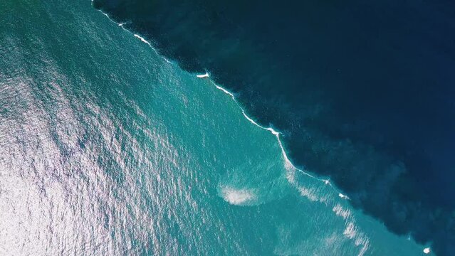 Boundary zone in the Atlantic Ocean. Aerial view of the dividing line of blue offshore water and murky coastal water in the ocean. Ocean water colliding zone