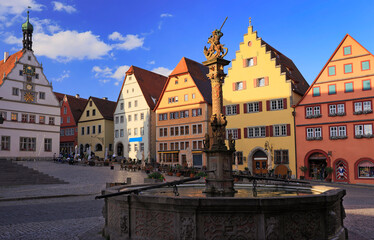 Fototapeta premium Markplatz with traditional houses and fountain on the foreground, Rothenburg ob der Tauber, Central Franconia in Bavaria, Germany
