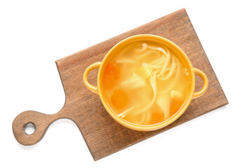 Pot of tasty chicken soup on white background